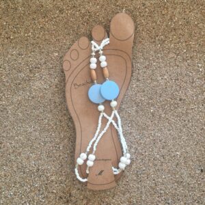 Feel like a barefoot princess in these stunning Beachals. Made with white and wooden beads showing off a blue wooden disc.