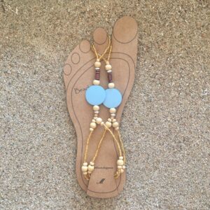 Beaded footwear the color of the sky with beach sand. Beautiful wooden beads with a blue disc. Hand made, boho styled, unique barefoot footwear.